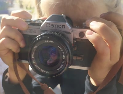 a woman taking a picture of herself taking a picture of herself