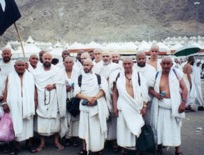 a group of men performing Hajj