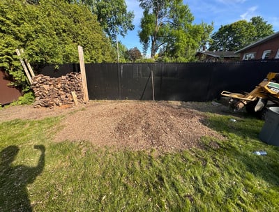 Stump removal in progress on a residential lawn in Saint-Lazare, restoring yard safety and appearanc