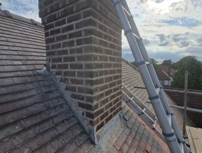 Chimney stack on roof repaired. Repointed brickwork