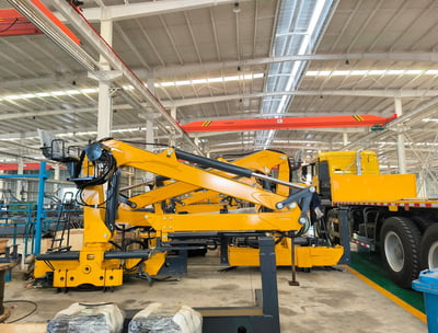 Factory snapshot: Yellow Q160LA2 knuckleboom log loader (timber crane for sale), custom-built for a client.