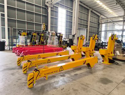 Yellow SQS42A-3 (2-ton telescopic) small truck mounted cranes on production floor.