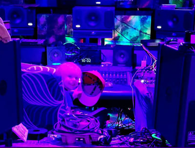 Kid sitting at the console in Deadly Mix Studios Dolby Atmos room