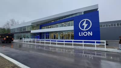 a large blue sign that says lion in front of a building