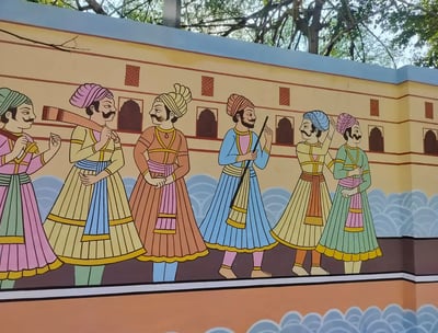 A wall painting of Indian men in traditional garments, reflecting the beautiful cultural expression and heritage.