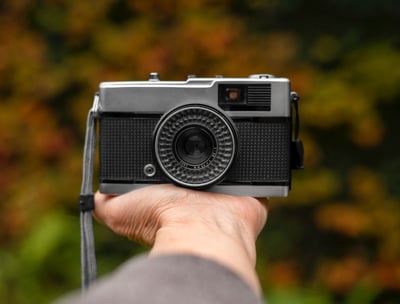 a person holding a camera in his hand