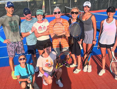 Adult tennis group enjoying sunny day in Panama City Beach, FL.