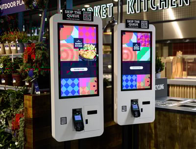 two self service touchpoints in a Cafe