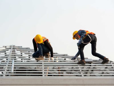 Men Installing House Roof Structure