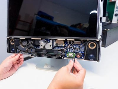 TV repair technician working on screen backlight in Patna