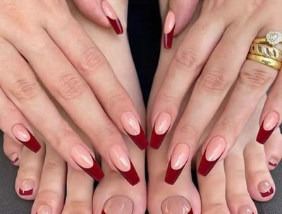 a woman's feet with a ring on her finger