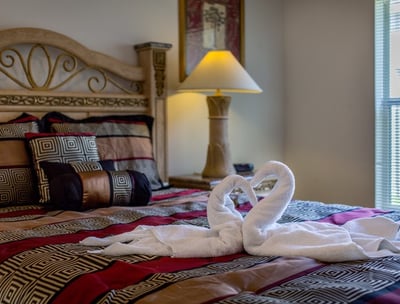 a swan towel on a bed