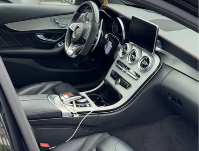 a car with a steering wheel and dashboard