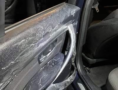 a car door with a door open and a car door open