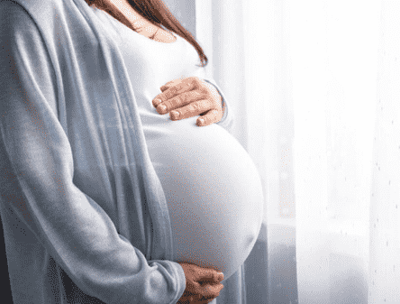 a pregnant woman with a white dress