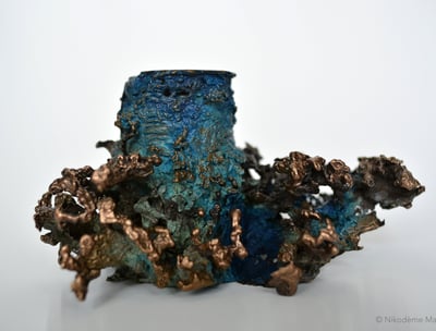 Photographie d'un bougeoir en bronze représentant des coraux