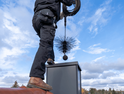 chimney sweeper on roof