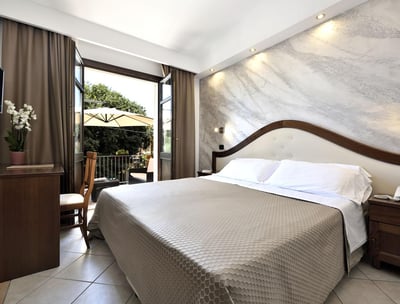 a bed room with a bed and a television