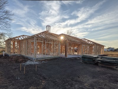 a house being built with a wooden frame