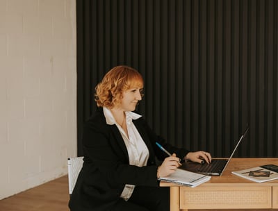 Stony Valley Business Services employee working at a laptop doing bookkeeping