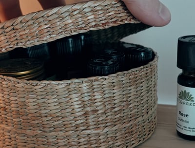 a straw box full of essential oil bottles