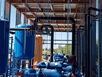 a large group of blue and white pumps in a building