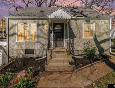 a house with a front porch and a front door