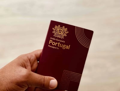 a person holding a passport and a passport