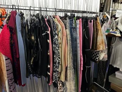 a rack of clothes and clothes hanging on a rack