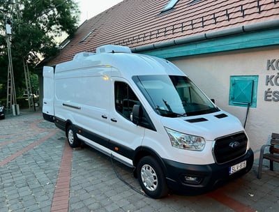 a van parked in front of a building