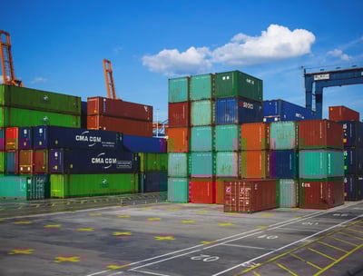 a large amount of containers stacked on top of each other