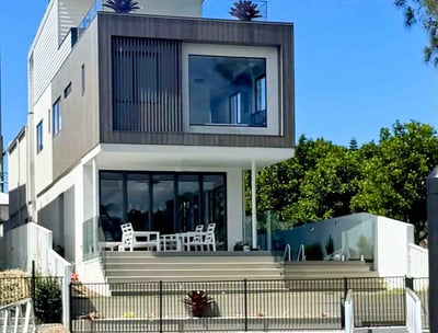 A happy family moving into their new home, with the assistance of a dedicated buyer’s advocate