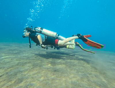 Female Scuba Diver underwater with perfect buoyancy
