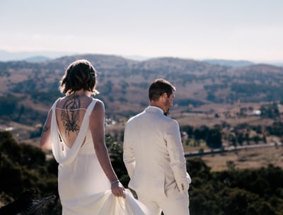 Bride and groom facing away from camera during first look, overlooking canberra hills. Wedding day captured by Canberra photo