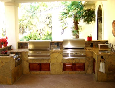 out side kitchen with 2 grills and sink by river oks builders 