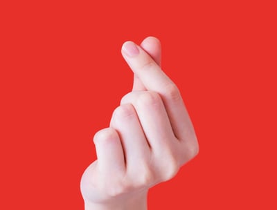 Hand forming a heart shape
