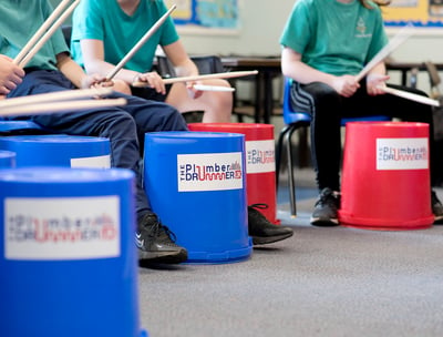 Group of young people bucket drumming