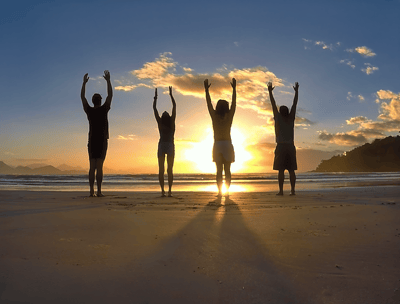 Yoga body movement on the beach for personal wellness during sunrise