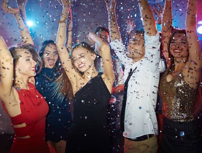 Group celebrating on a party bus with open bar during a Vegas nightlife crawl.