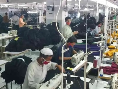 Manufacturing line producing high-quality tactical gloves, knee pads, and protective vests.