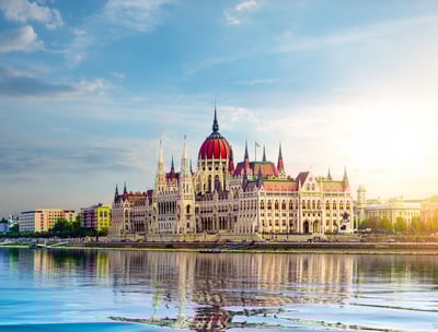 An image of the Parliament office in Budapest, Hungary, overlooking the clear water lake