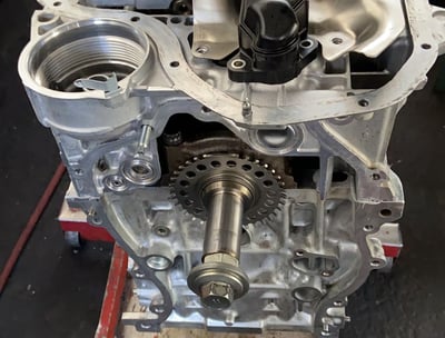 a car engine with a small engine in a garage