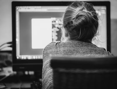 a woman working on a computer software