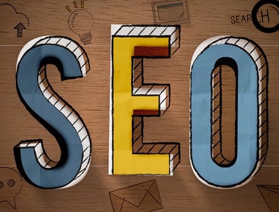 a wooden sign that says seo is a great way to improve your search engine