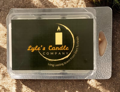 a candle was container that is sitting on a table