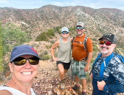 a group of people standing on a mountain top