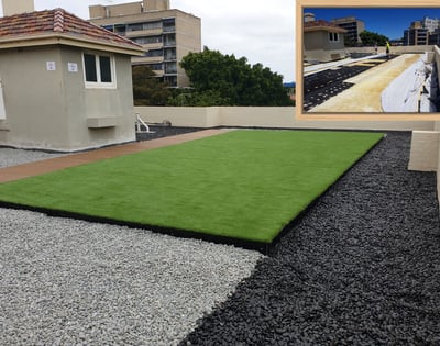 Artificial grass rooftop deck with pebble surrounds