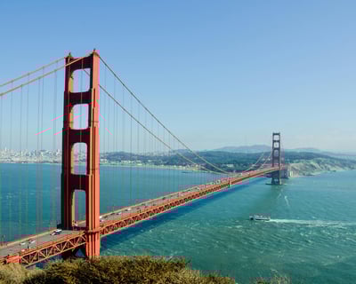 a bridge spanning the golden gate bridge over looking the water