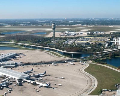 a large airport with a lot of airplanes and planes