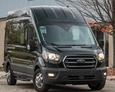 a black van parked in front of a building